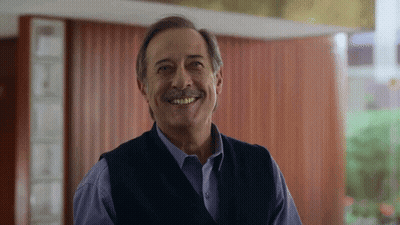 Man With Mustache Smiling In Room GIF