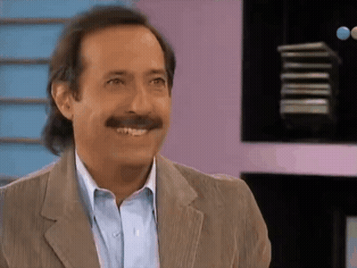 Man With Mustache Smiling In Suit And Blue Shirt GIF
