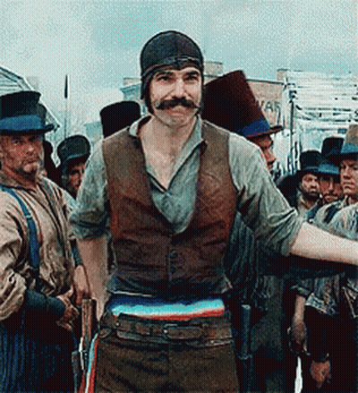 Man With Mustache Standing In Front Of Group GIF