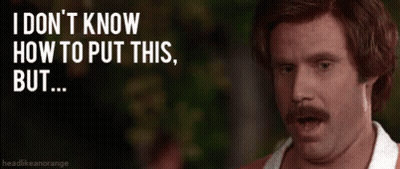 Man With Mustache Standing In Front Of Sign Saying I Don't Know How To Put This But GIF