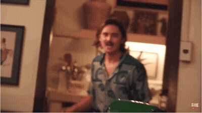 Man With Mustache Standing In Room GIF