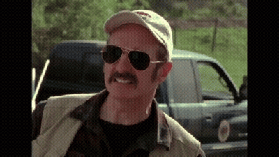 Man With Mustache, Sunglasses, And Hat By Truck GIF