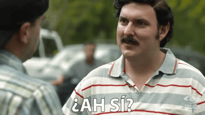 Man With Mustache Talking Man In ¿Ah Sí? Shirt GIF