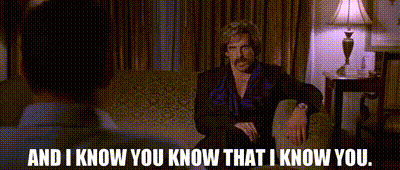Man With Mustache Talking On Couch GIF