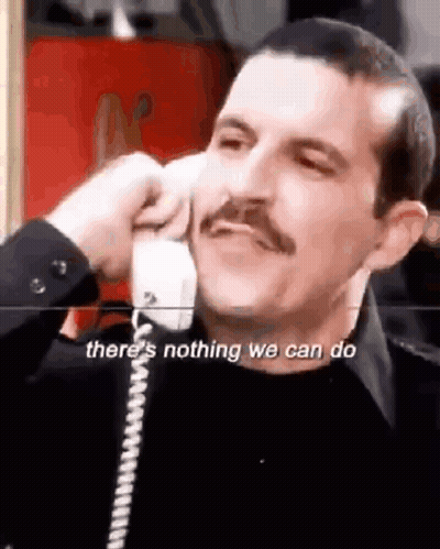 Man With Mustache Talking on Phone Says There's Nothing We Can Do