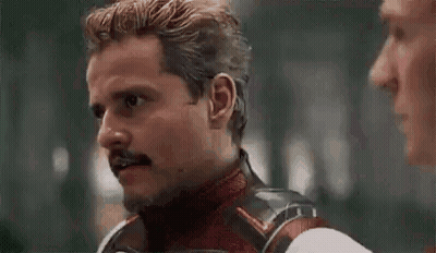 Man With Mustache Talking To Another Man GIF