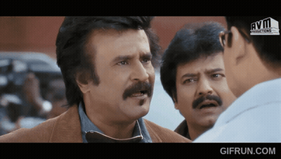 Man With Mustache Talking To Another Man GIF