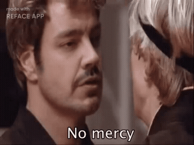 Man With Mustache Talking To Woman With Knife GIF