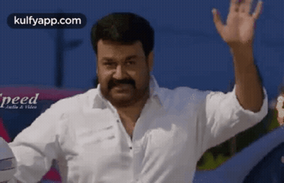 Man With Mustache Waving In Front Of Car GIF