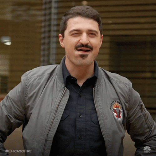 Man With Mustache Wearing Bomber Jacket Saying Chicago Fire GIF