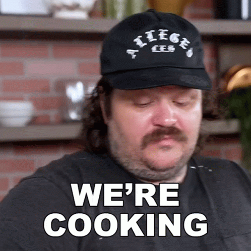 Man With Mustache Wearing Hat Saying We're Cooking GIF