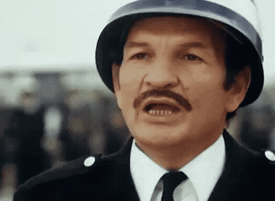 Man With Mustache Wearing Helmet Making Funny Face GIF