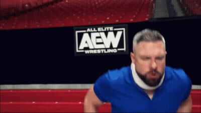 Man With Neck Brace In Front Of AEW Wrestling Sign GIF