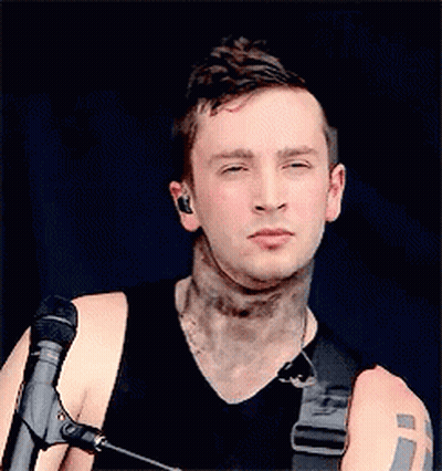 Man With Neck Tattoo And Eyes Closed At Microphone GIF