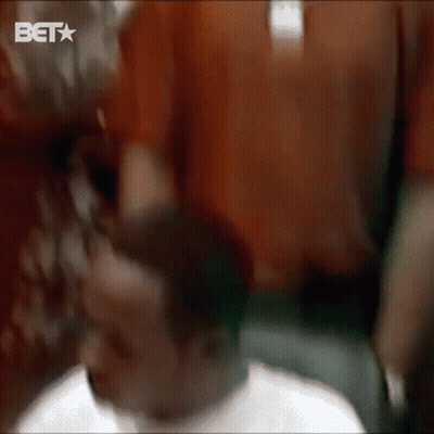 Man With Neck Tattoo Holding Red Pro Re GIF