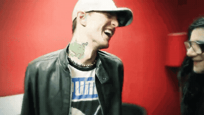 Man With Neck Tattoo Laughing In Puma Shirt GIF