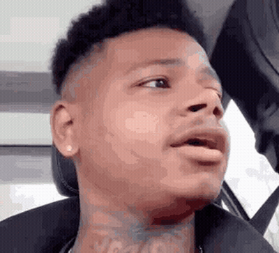 Man With Neck Tattoo Making Funny Face In Car GIF