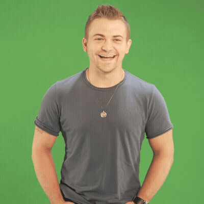 Man With Necklace Laughing On Green Background GIF