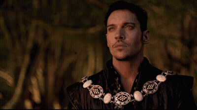 Man With Necklace Looking Up GIF