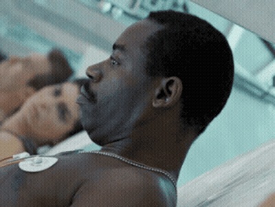 Man With Necklace Lying In Hospital Bed GIF