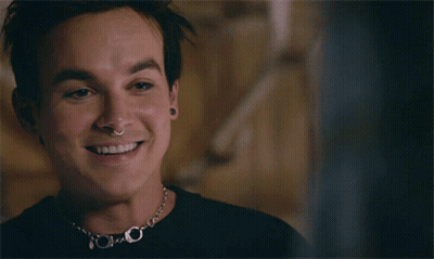 Man With Nose Ring And Necklace Smiling GIF