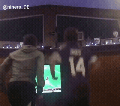Man With Number 14 On Back Before Television GIF
