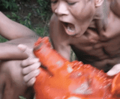Man With Open Mouth Holding Red Object GIF