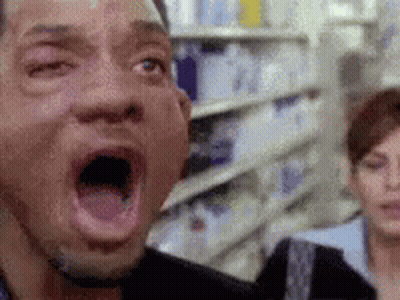 Man With Open Mouth In Store GIF