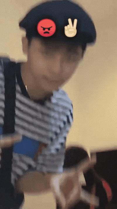 Man With Peace Sign Hat And Angry Face GIF