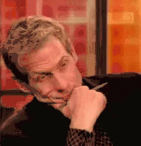 Man With Pen In Mouth Making Face GIF