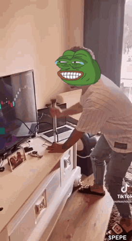 Man With Pepe The Frog Face In Front Of Laptop GIF