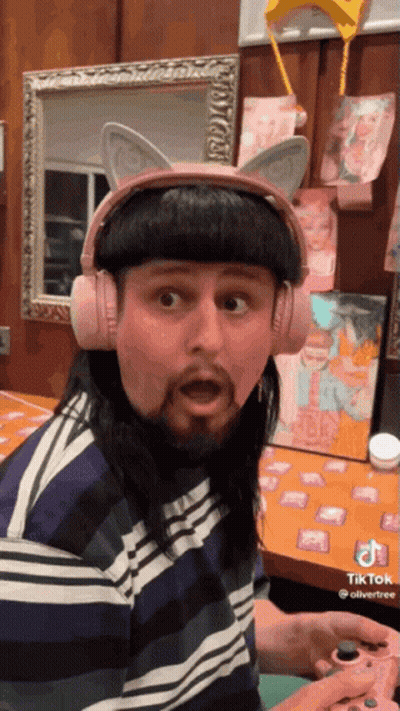 Man With Pink Cat Ear Headphones Playing Game GIF