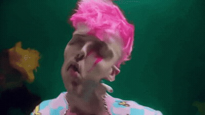 Man With Pink Hair And Earrings In Pink And Blue Shirt GIF