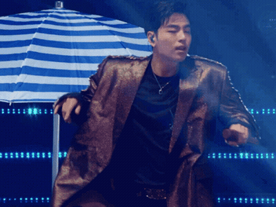 Man With Pink Hair Singing Into Microphone In Black Jacket And Choker GIF