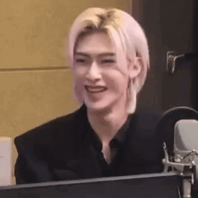 Man With Pink Hair Smiling At Microphone GIF