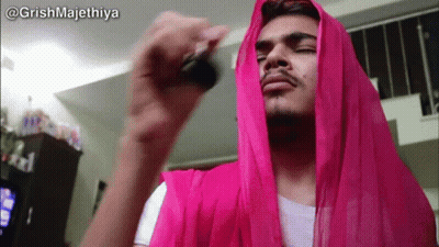 Man With Pink Scarf Holding Key GIF