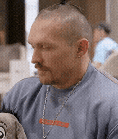 Man With Ponytail And Hermes Necklace GIF