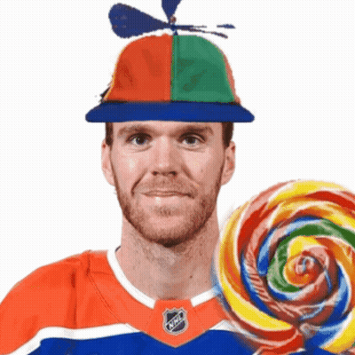 Man With Propeller Hat Holding Lollipop GIF