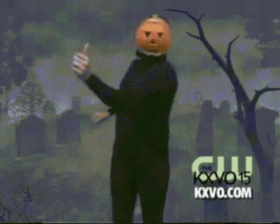 Man With Pumpkin Head Dancing In Cemetery Sponsored By KXVO15 GIF
