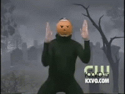 Man With Pumpkin Head Dancing In Cemetery With Fox News Logo GIF