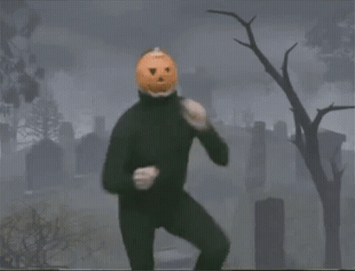 Man With Pumpkin Head In Cemetery GIF