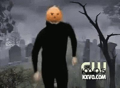 Man With Pumpkin Head In Cemetery GIF