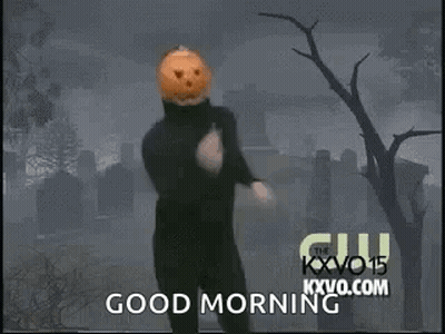 Man With Pumpkin Head Running In Cemetery Saying Good Morning GIF