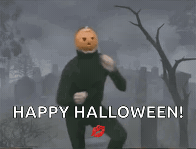 Man With Pumpkin Head Running In Cemetery Says Happy Halloween GIF