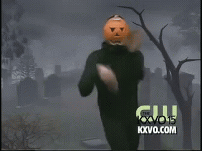Man With Pumpkin On Head Dancing In Front Of KXVO Logo GIF