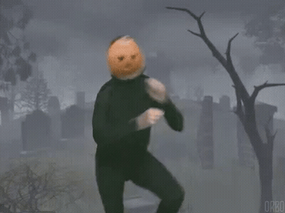 Man With Pumpkin On Head In Cemetery GIF
