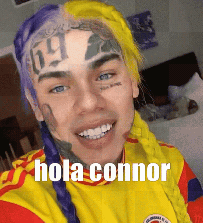 Man With Purple And Yellow Hair Saying Hola Connor GIF