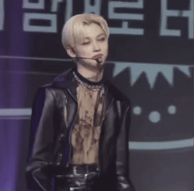 Man With Purple Hair Holding Microphone Smiling GIF