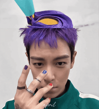 Man With Purple Hair In Green Jacket Saying April GIF