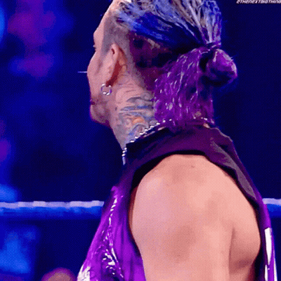 Man With Purple Hair Standing In Ring GIF